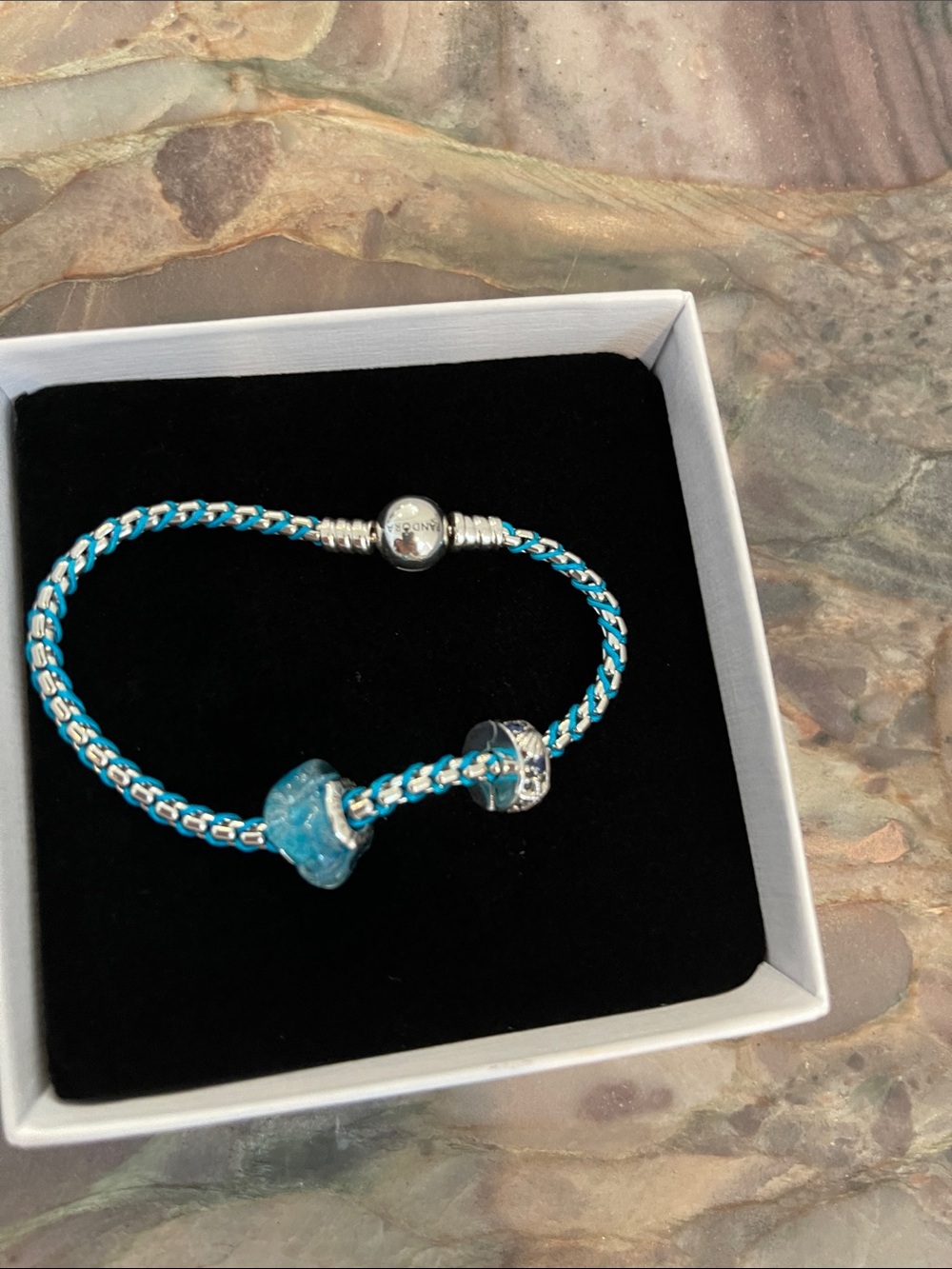 New Pandora Blue Cord Snake
Chain Bracelet with two PANDORA Charms